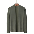 Olive green knitted open-front cardigan with textured pattern, hanging on wooden hanger | Chaps London