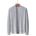 Gray knitted open-front cardigan with textured pattern, hanging on wooden hanger | Chaps London