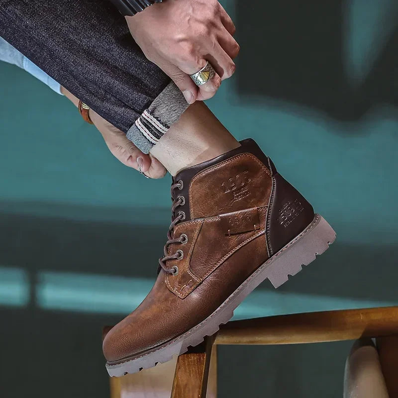 Brown faux leather lace-up ankle boot worn by person on bench | Chaps London
