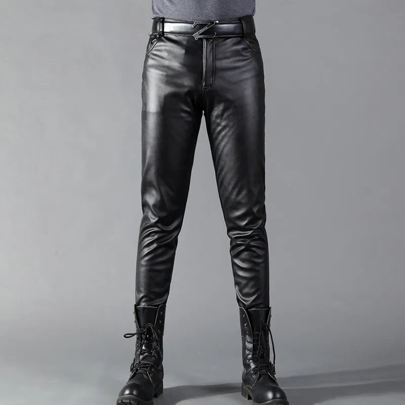 Man wearing black faux leather slim fit trousers with belt, paired boots | Chaps London