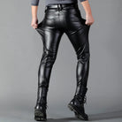 Man wearing black faux leather skinny trousers, pulling pockets, rear view | Chaps London