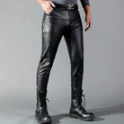 Man wearing black faux leather slim fit pants with buckled belt | Chaps London