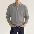 Man wearing gray long sleeve collared polo sweater with dark jeans | Chaps London