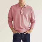 Man wearing pink knit polo sweater with buttoned collar and denim jeans | Chaps London