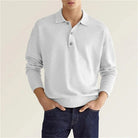 Man wearing light gray long-sleeve collared polo sweater with dark jeans | Chaps London