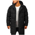 Man wearing black quilted long puffer jacket with hood, worn casually | Chaps London