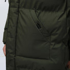 Dark olive green puffer jacket pocket detail, worn by person | Chaps London