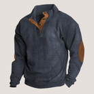 Navy ribbed quarter-zip sweater with tan suede elbow patches, flat-laid | Chaps London