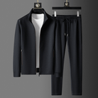 Black zip-up jacket and matching joggers displayed on hangers | Chaps London