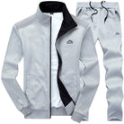Gray zip-up tracksuit jacket and pants, flat lay with mountain logo | Chaps London