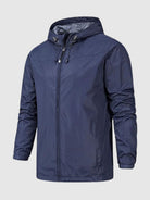 Navy blue hooded windbreaker jacket with drawstring, worn by a person | Chaps London