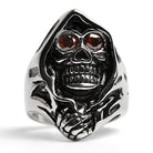 Silver skull ring with red gemstone eyes, shown flat | Chaps London