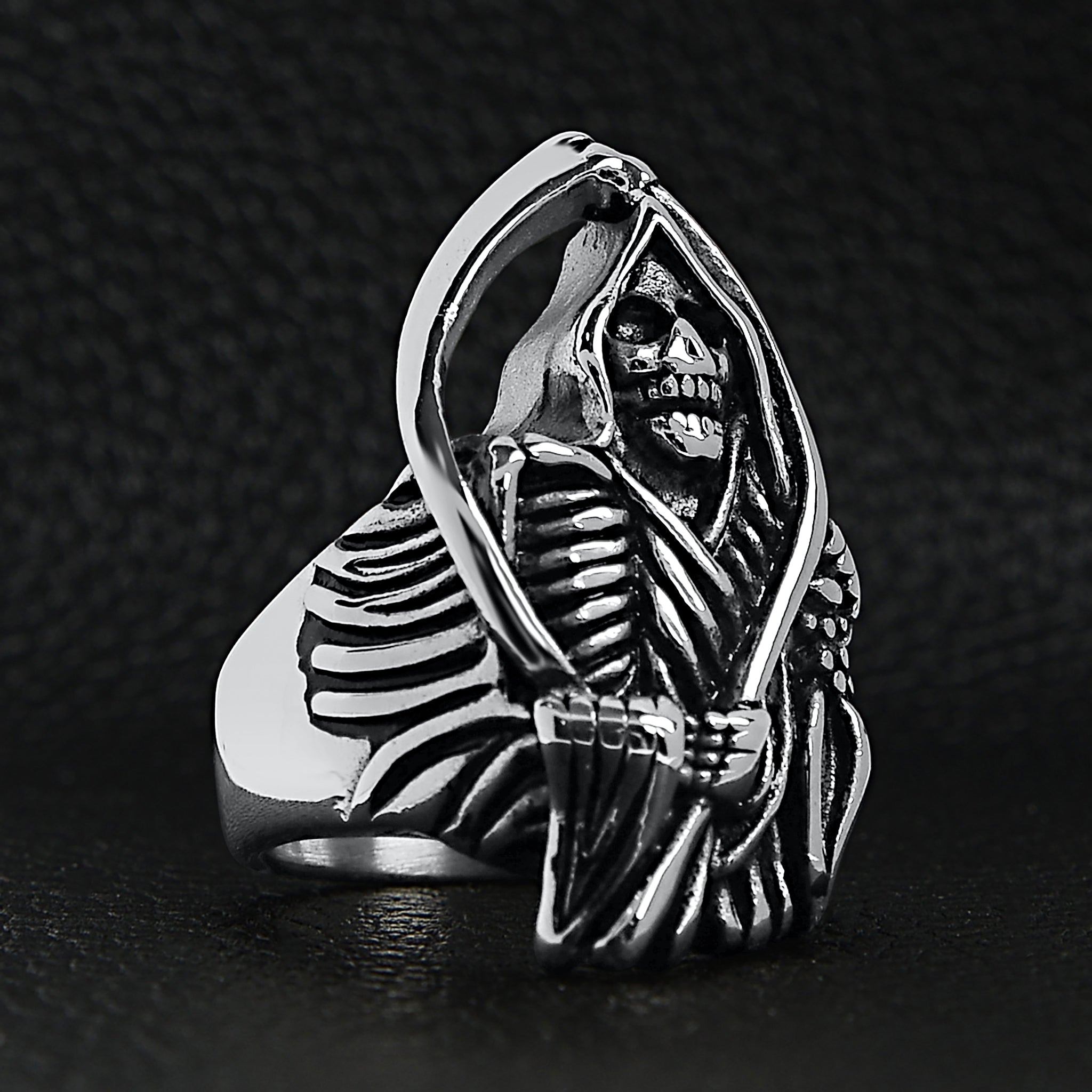 Silver ring featuring hooded grim reaper skeleton holding scythe, shown flat | Chaps London