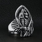 Silver ring featuring hooded grim reaper skeleton holding scythe, shown flat | Chaps London