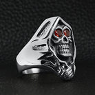 Silver hooded grim reaper skull ring with red gemstone eyes, displayed solo | Chaps London
