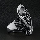 Silver grim reaper skull ring, detailed skeleton design, shown flat on black background | Chaps London