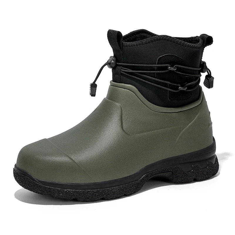 Olive green rubber ankle rain boot with a black neoprene collar, bungee drawstring lacing and a black lugged sole, shown in three quarter view on a white background.
