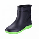 Black short ankle boot with green sole, shown standalone on white background | Chaps London