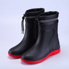 Black ankle rain boots with red soles, drawstring cuffs, shown paired | Chaps London