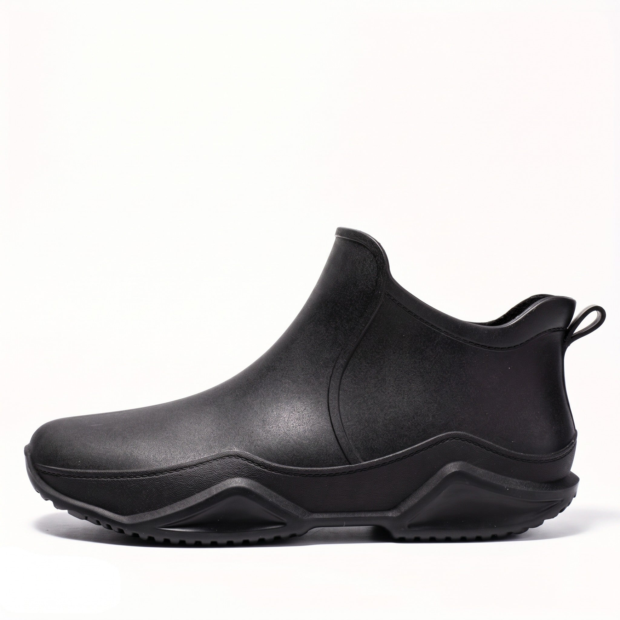 Black ankle rain boot with wave sole, shown in side profile | Chaps London
