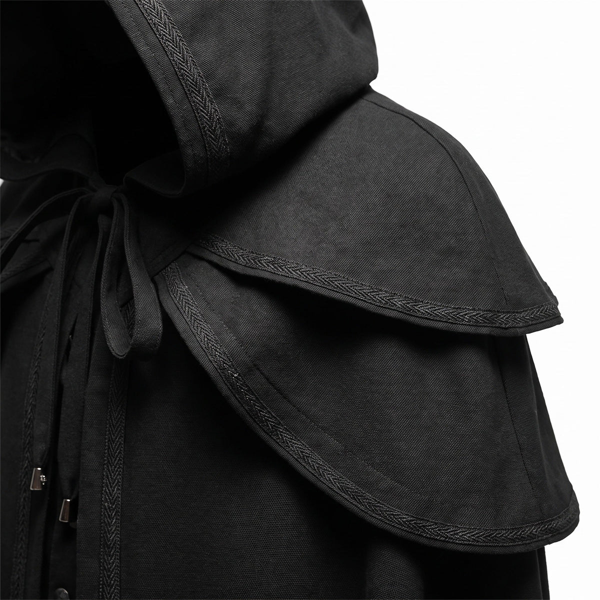 Black hooded cape with layered shoulder cape, braided trim detail, close-up view | Chaps London