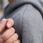 Gray raglan knit hoodie shoulder seam detail, worn, close-up view | Chaps London