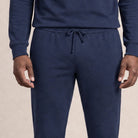 Man wearing navy joggers and hoodie, drawstring waist, worn by person | Chaps London