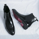 Black faux leather Chelsea boots with red sole, flat lay pair view | Chaps London