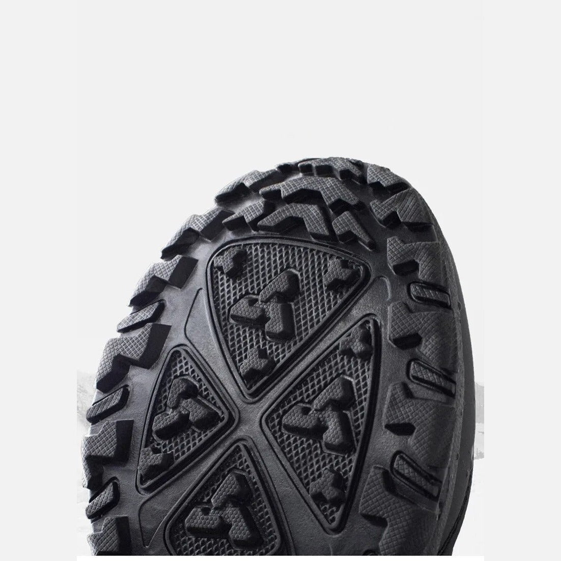 Black rubber boot sole with triangular tread pattern, bottom view shown | Chaps London