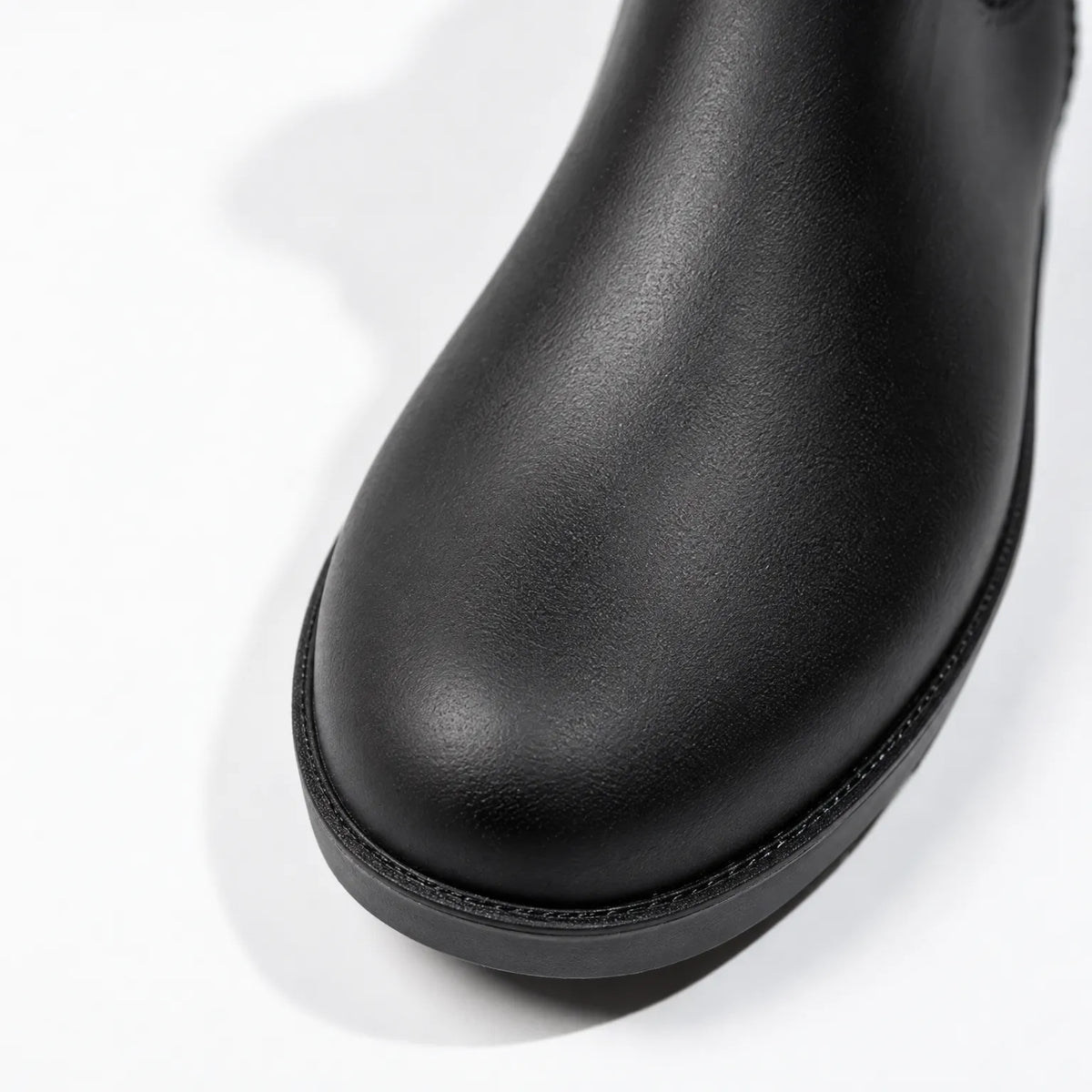 Close-up of the rounded toe of the black welly