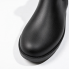 Close-up of the rounded toe of the black welly