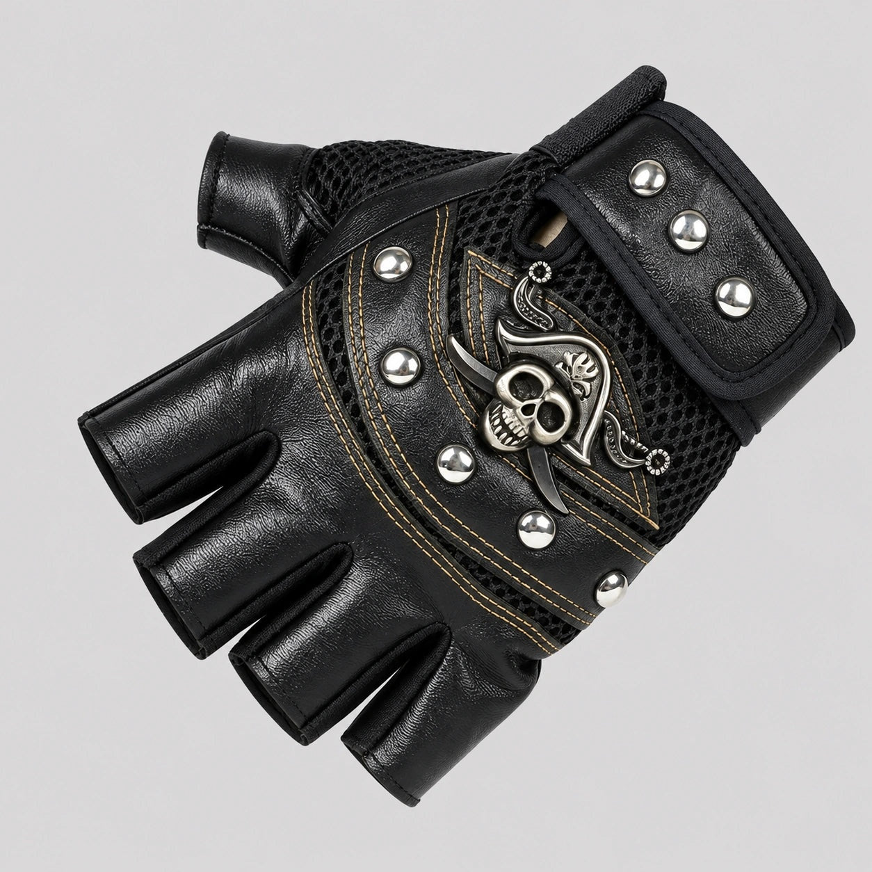 Black fingerless biker glove with skull emblem, rivets, and mesh detailing shown flat | Chaps London