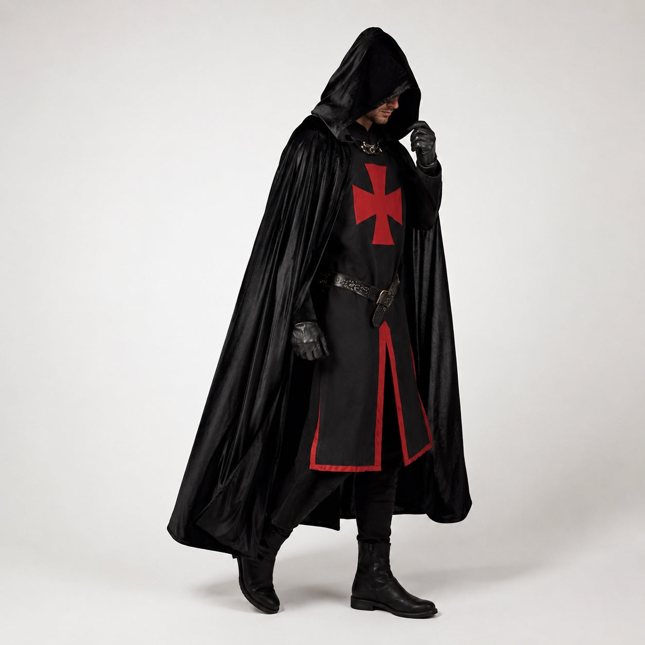 Man wearing black hooded cloak with red cross tunic and belt | Chaps London