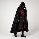 Man wearing black hooded cloak with red cross tunic and belt | Chaps London