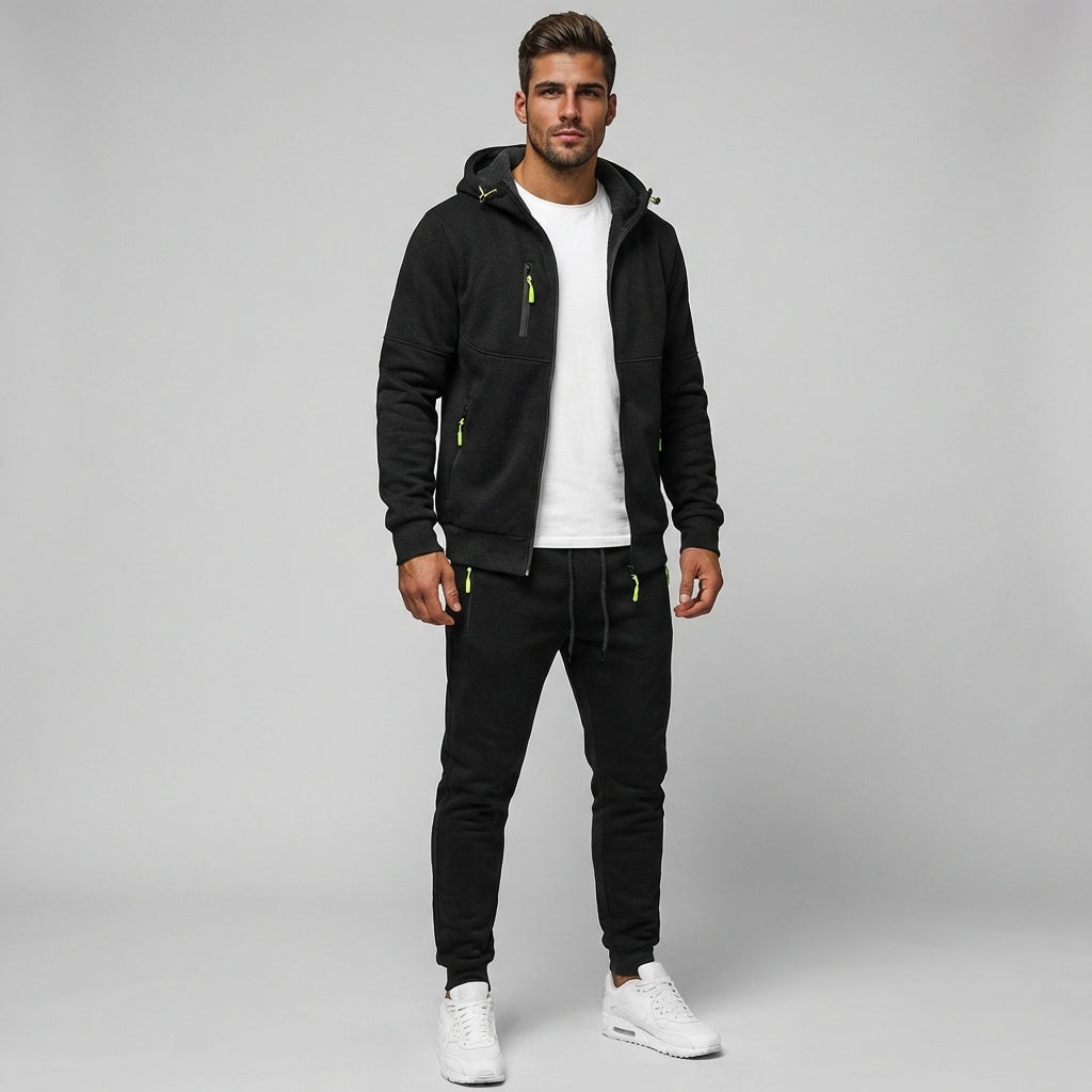 Man wearing black zip hoodie with white t-shirt and black joggers | Chaps London