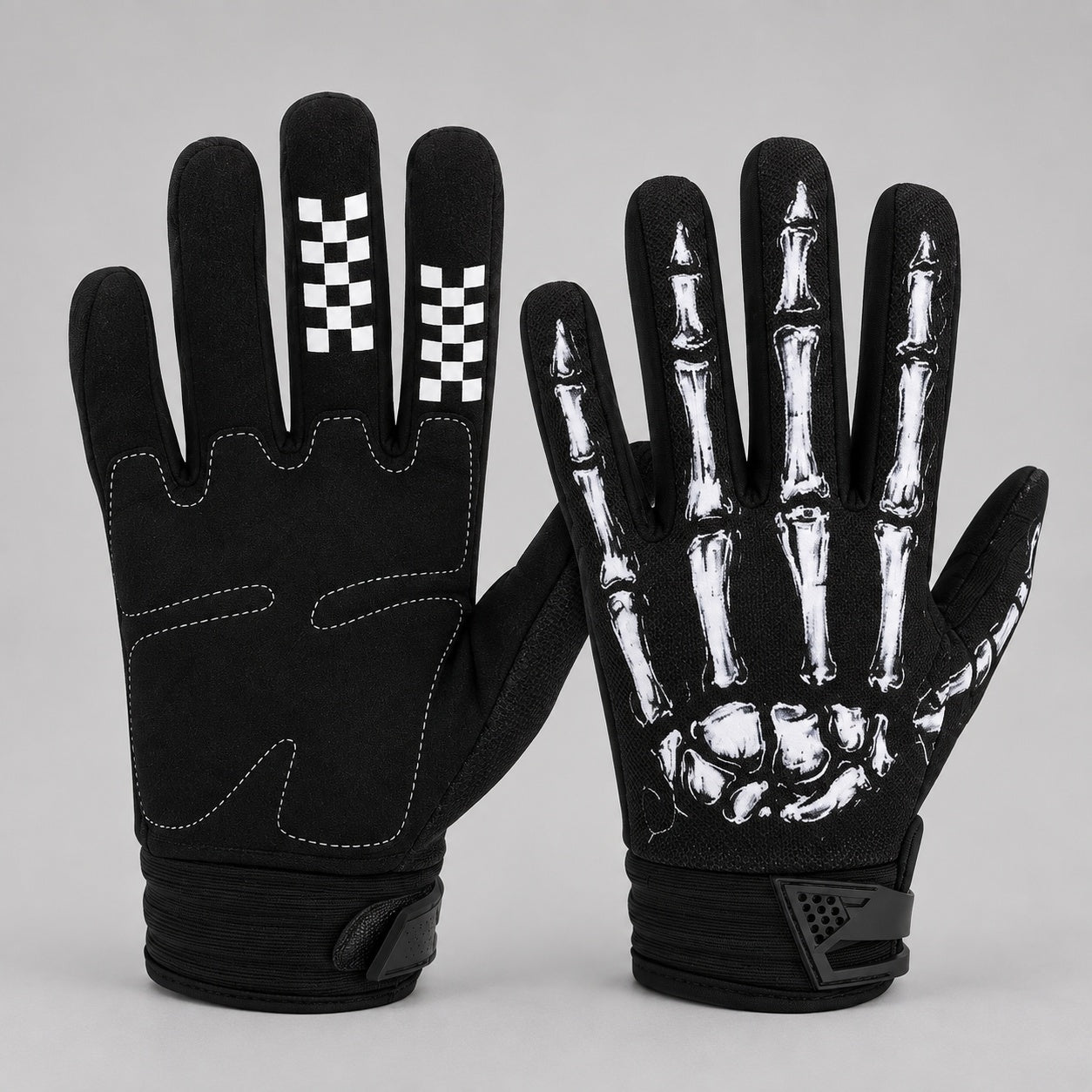 Black gloves with white skeleton hand print, checkered fingertips, shown flat | Chaps London