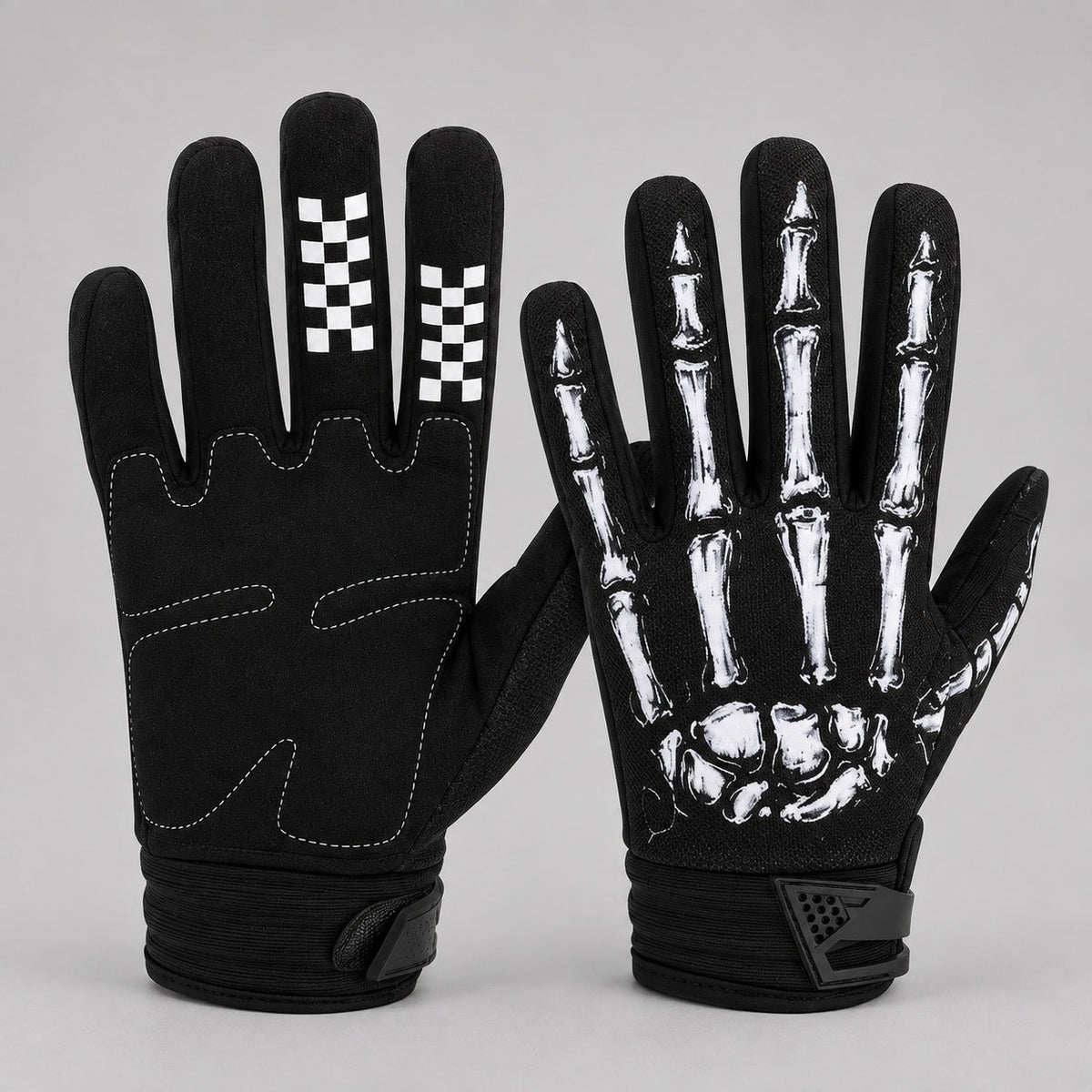 Black gloves with white skeleton hand print, checkered fingertips, shown flat | Chaps London