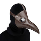 Brown plague doctor mask with round eye lens worn by person | Chaps London