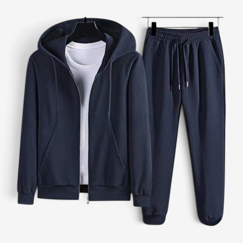 Navy blue waffle-texture zip hoodie and matching joggers on hanger display | Chaps London