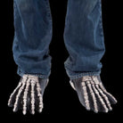Gray skeleton feet shoe covers worn over jeans and shoes | Chaps London