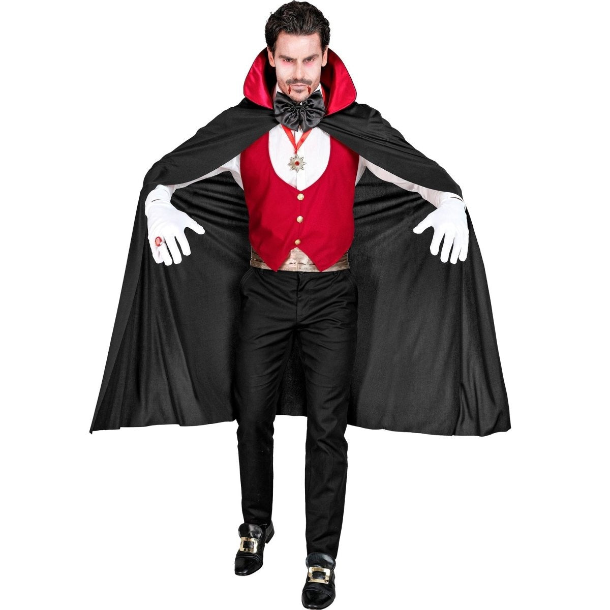 Man wearing black vampire cape, red waistcoat and white gloves, arms outstretched | Chaps London