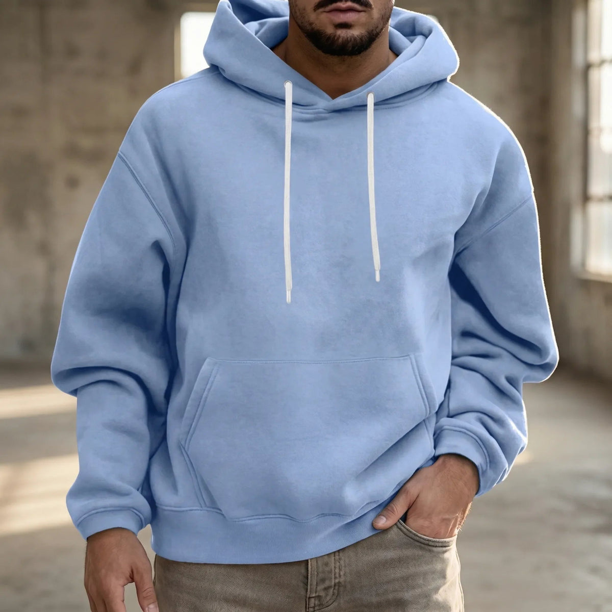 Light blue hoodie with white drawstrings worn by man indoors | Chaps London