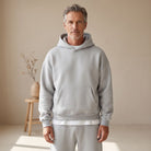 Man wearing light grey hoodie and matching jogger sweatpants outdoors | Chaps London