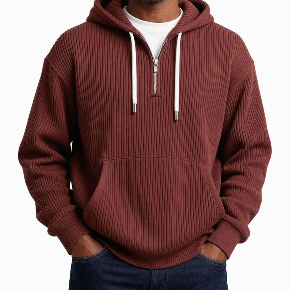 Man wearing rust-colored ribbed half-zip hoodie with white drawcords, hands in pockets | Chaps London