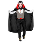 Man wearing black vampire cape with red lining and grey waistcoat costume | Chaps London