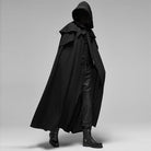 Man wearing black hooded gothic cape with boots, side view | Chaps London