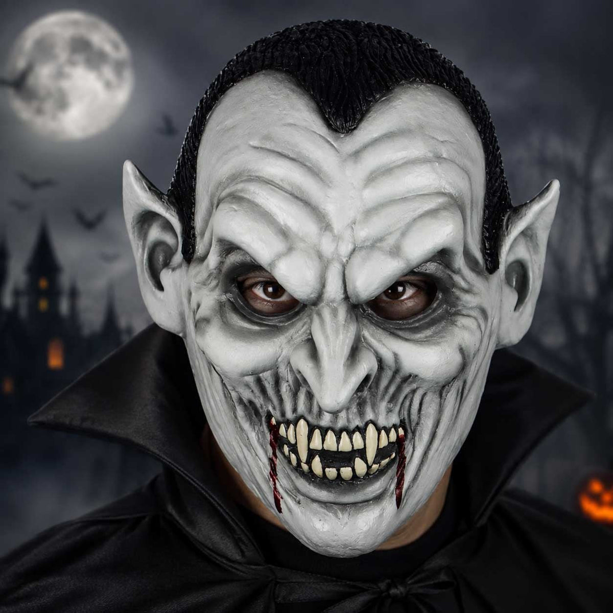 Gray vampire mask with pointed ears and fangs, worn by person | Chaps London