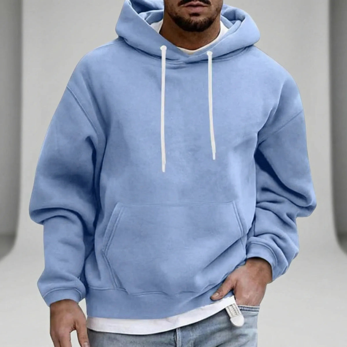 Light blue hoodie with white drawcords, worn by a man, front view | Chaps London
