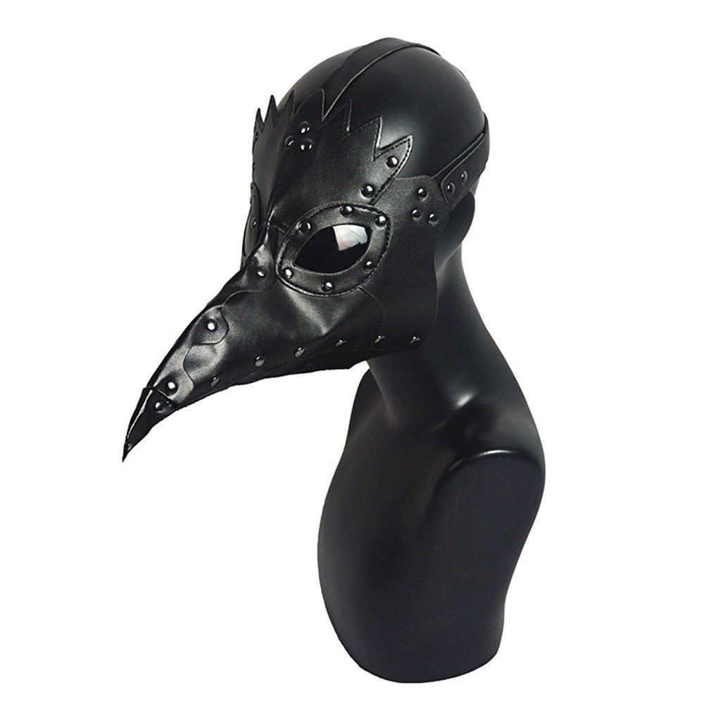 Black plague doctor mask with long beak on black mannequin bust | Chaps London