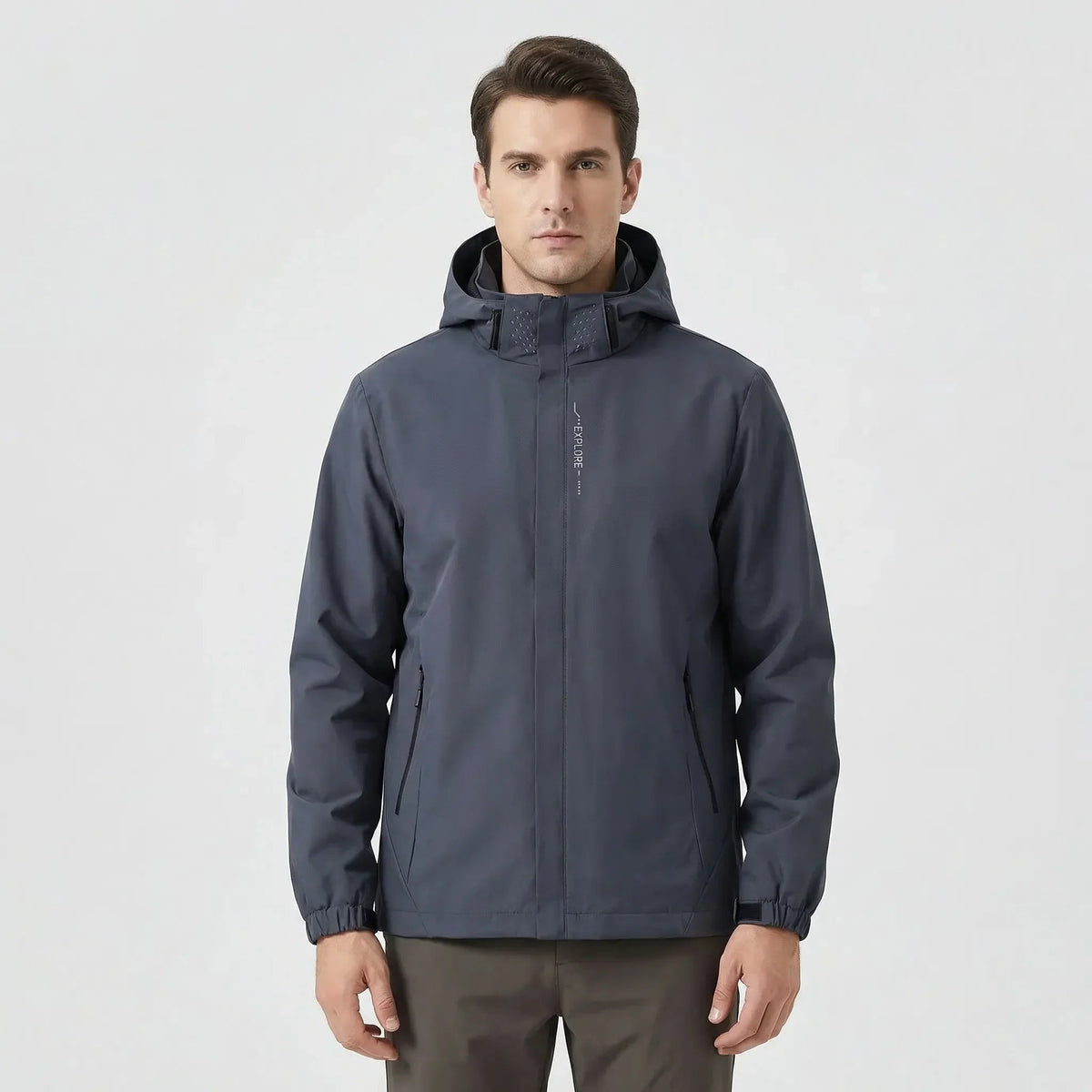 Man wearing dark grey hooded zip-up jacket with front pockets, front view | Chaps London